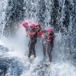 girls-under-waterfall